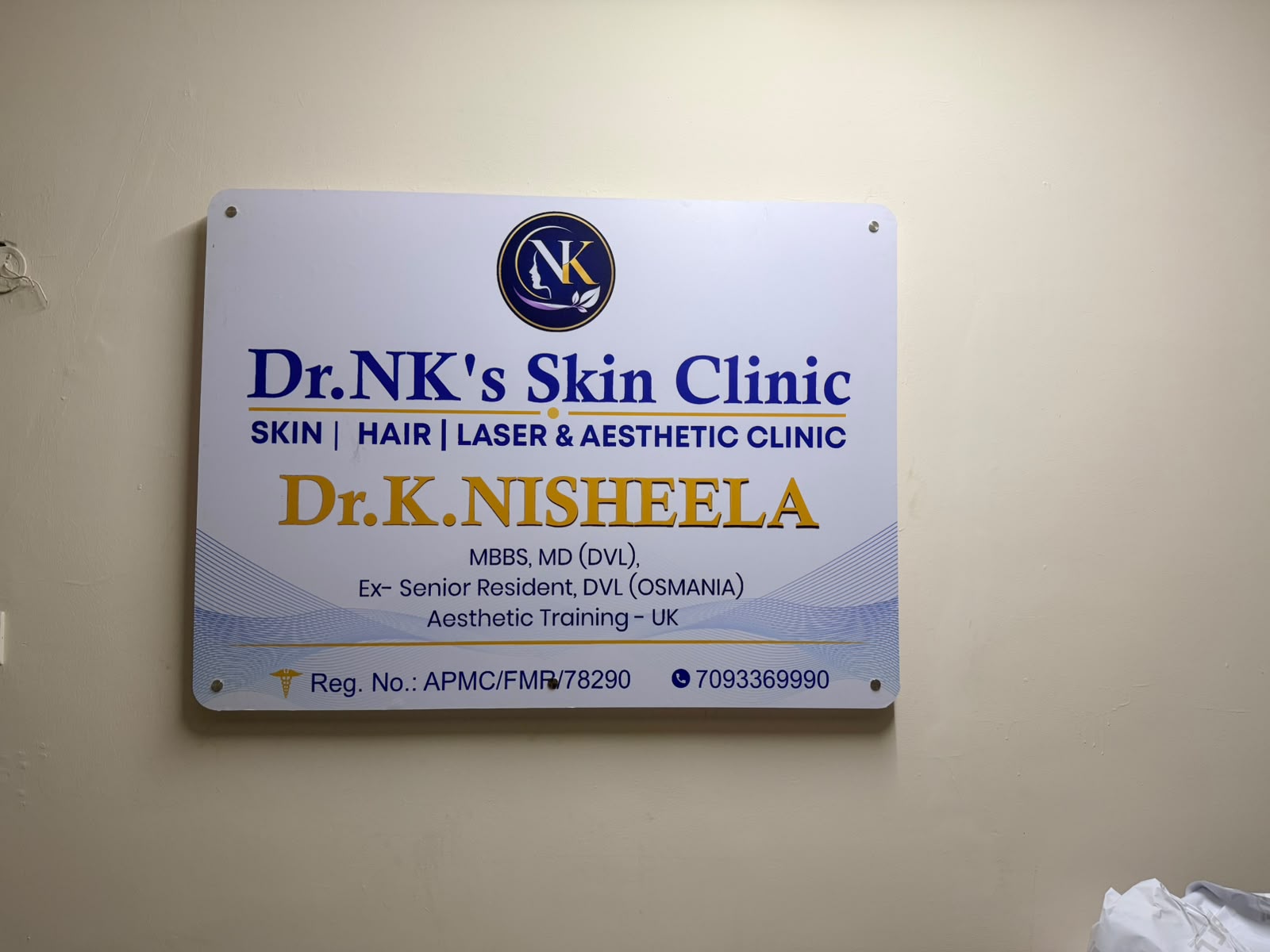 Dr. K Nisheela's clinic credentials plaque